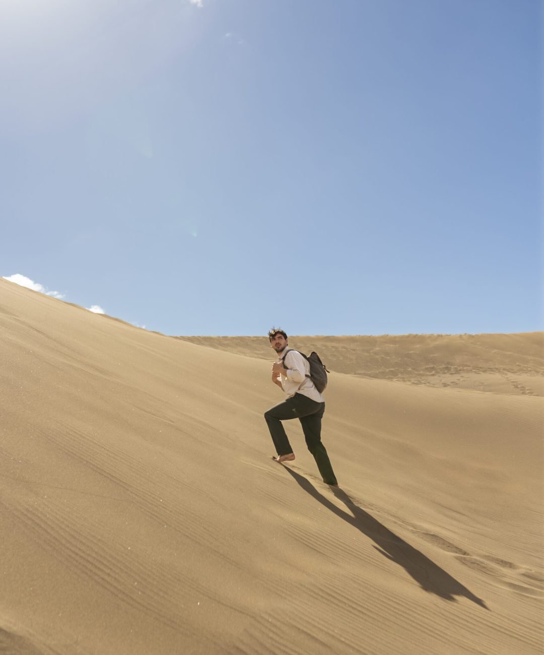 long-shot-man-carrying-backpack